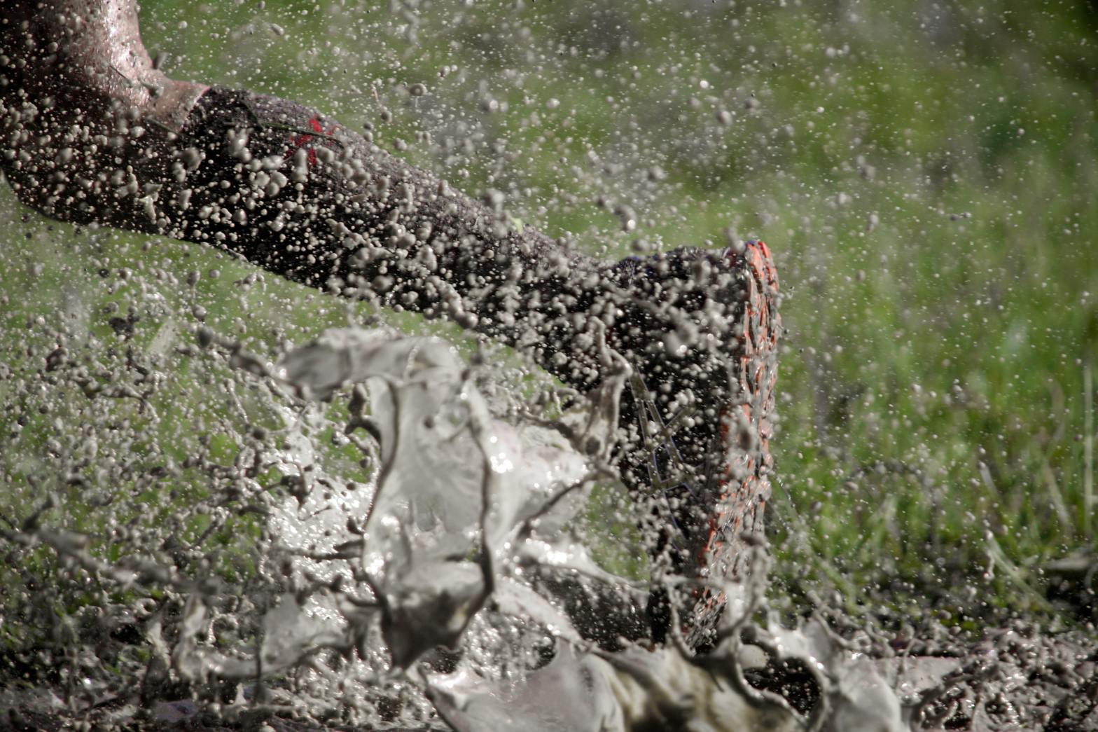 person running through the mud